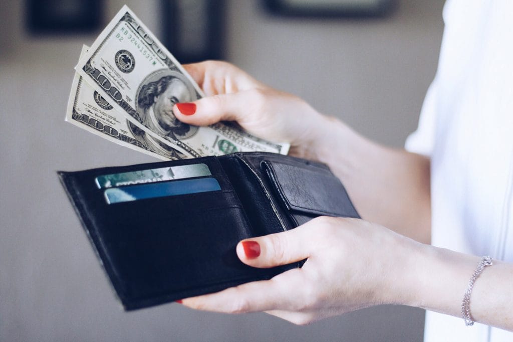 Woman Holding Money From Wallet