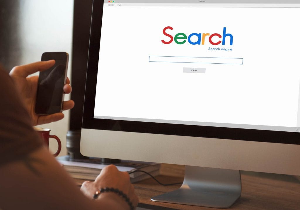 Person Typing on a Search Engine